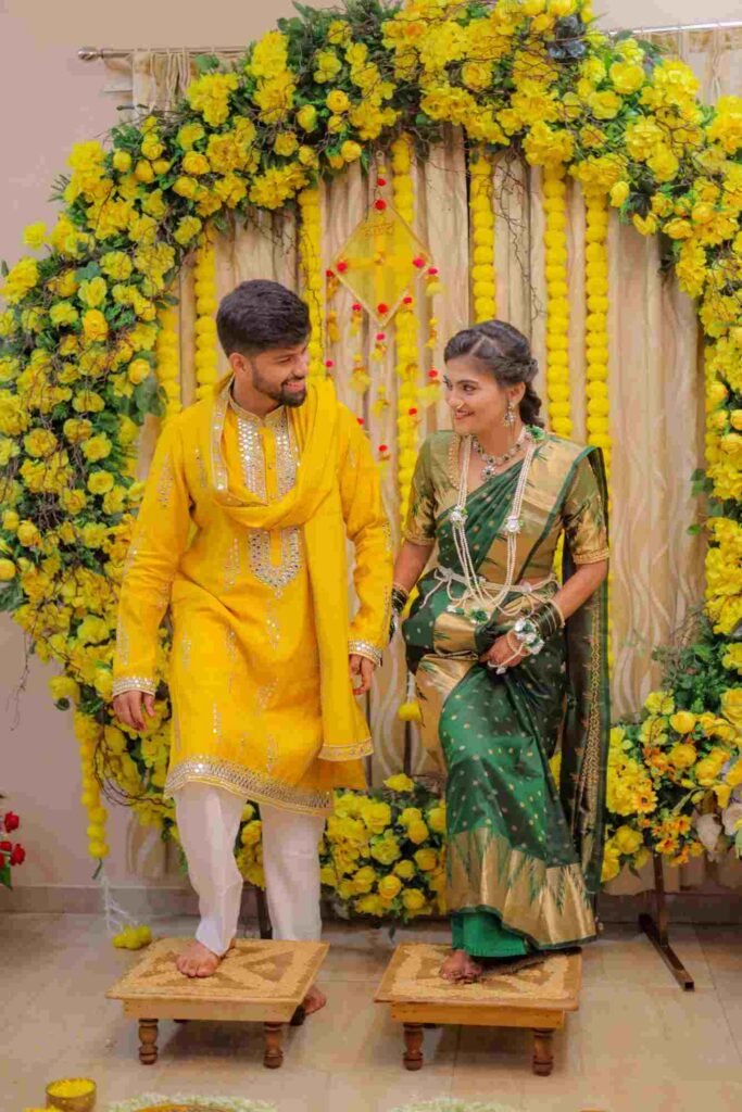 Bride and groom holding hands during a traditional Haldi ritual in Lonavala