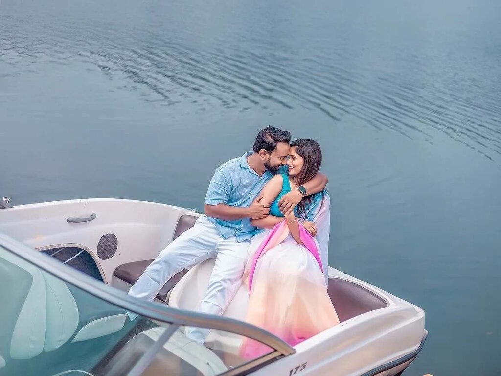 Couple sharing a romantic moment together on a speedboat during a lakeside pre-wedding shoot